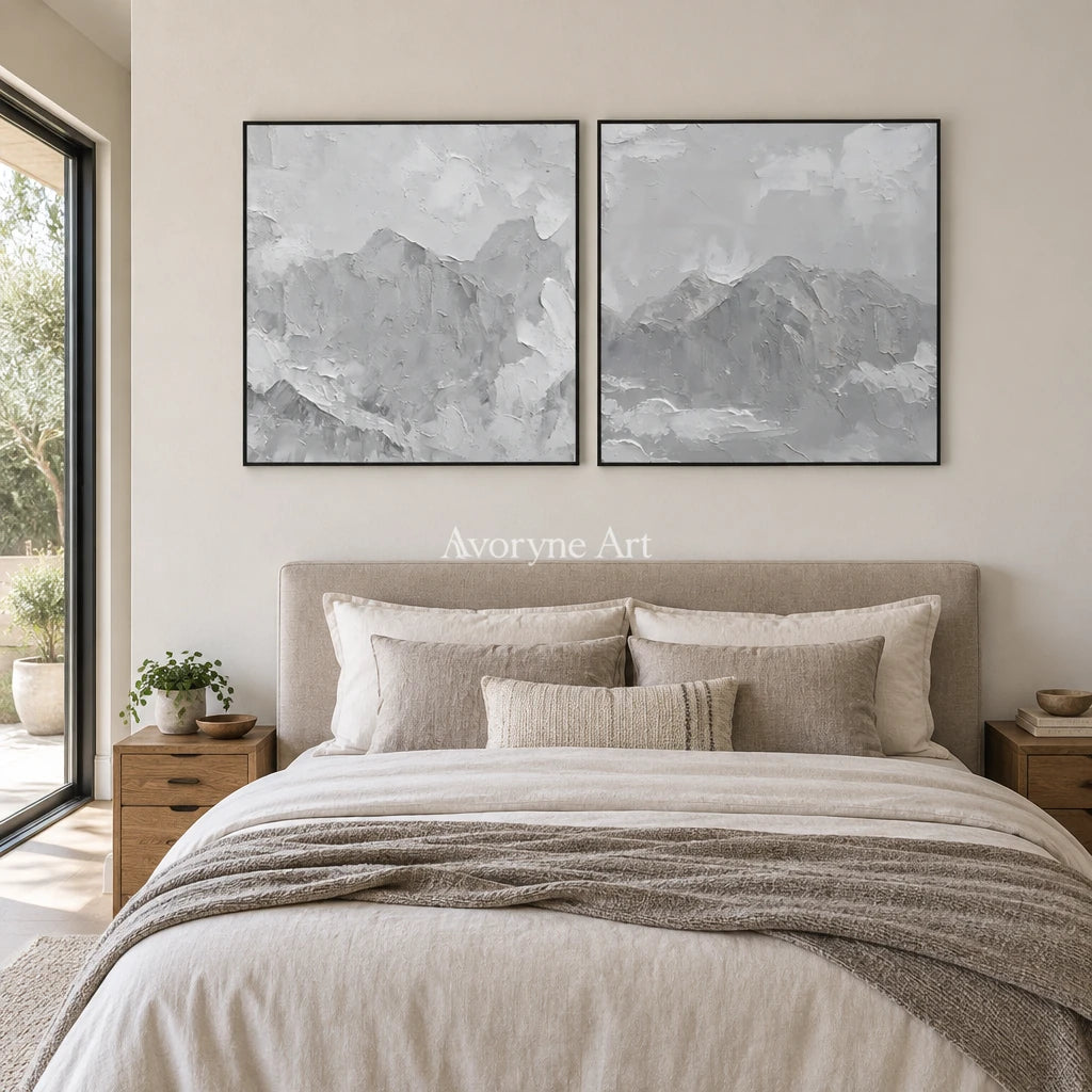Muted Memory pale mountain relief diptych with a black frame above a bed in a bedroom