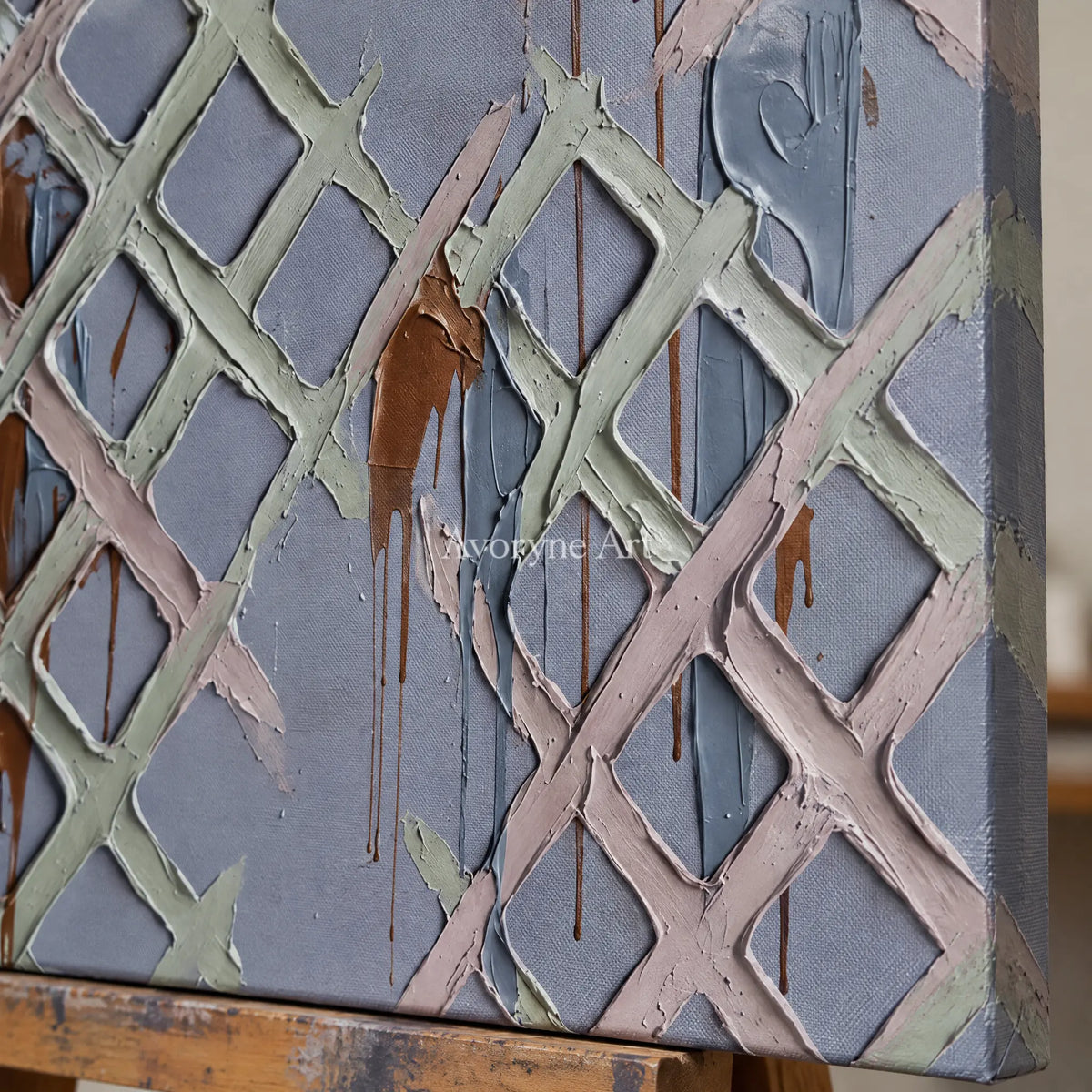 Close-up of the hand-painted texture of Weathered Field pastel grid texture wall art on an easel