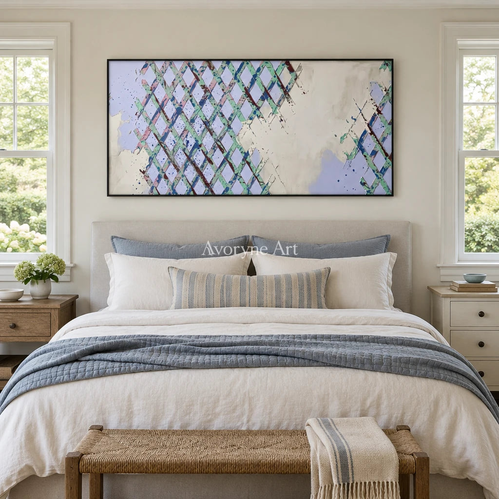 Earthen Rhythm pastel grid texture wall art with a black frame above a bed in a bedroom