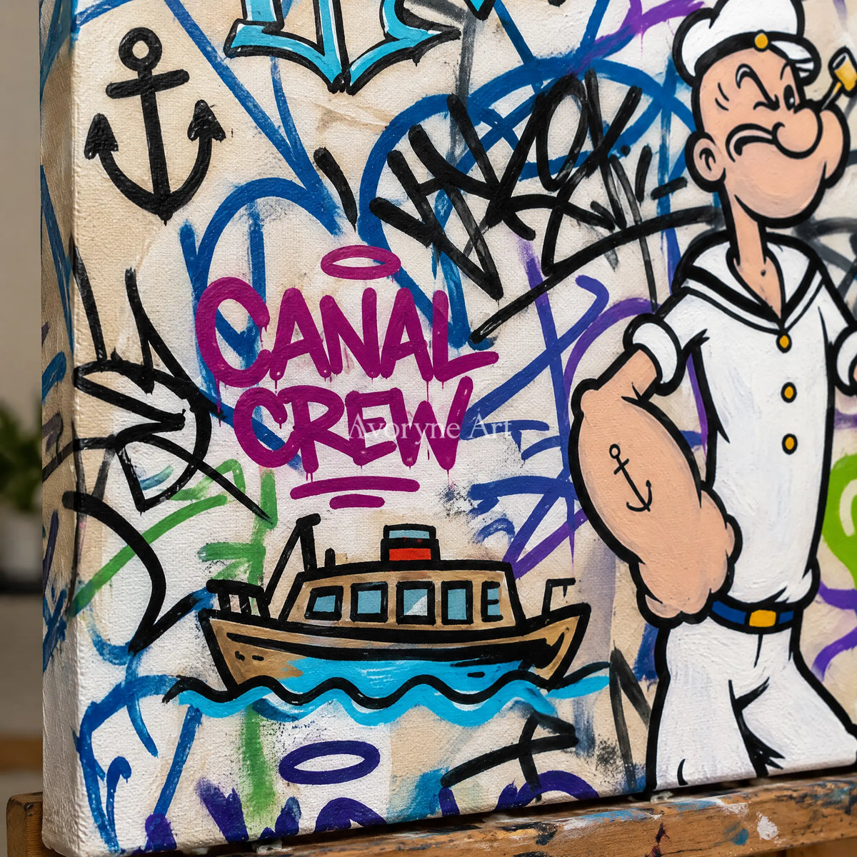 Close-up of the hand-painted texture of Soft Story playful character wall art on an easel