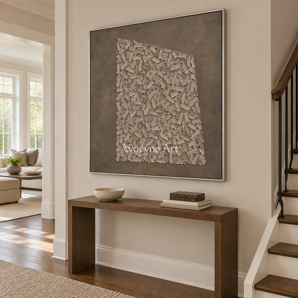 Quiet Cadence relief mosaic wall art with a silver frame in an entryway