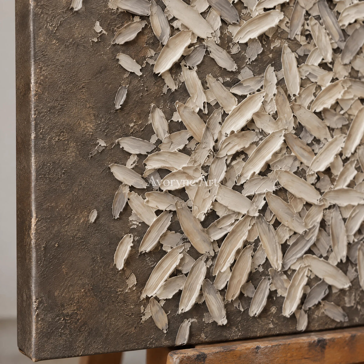 Close-up of the hand-painted texture of Amber Interval relief mosaic wall art on an easel