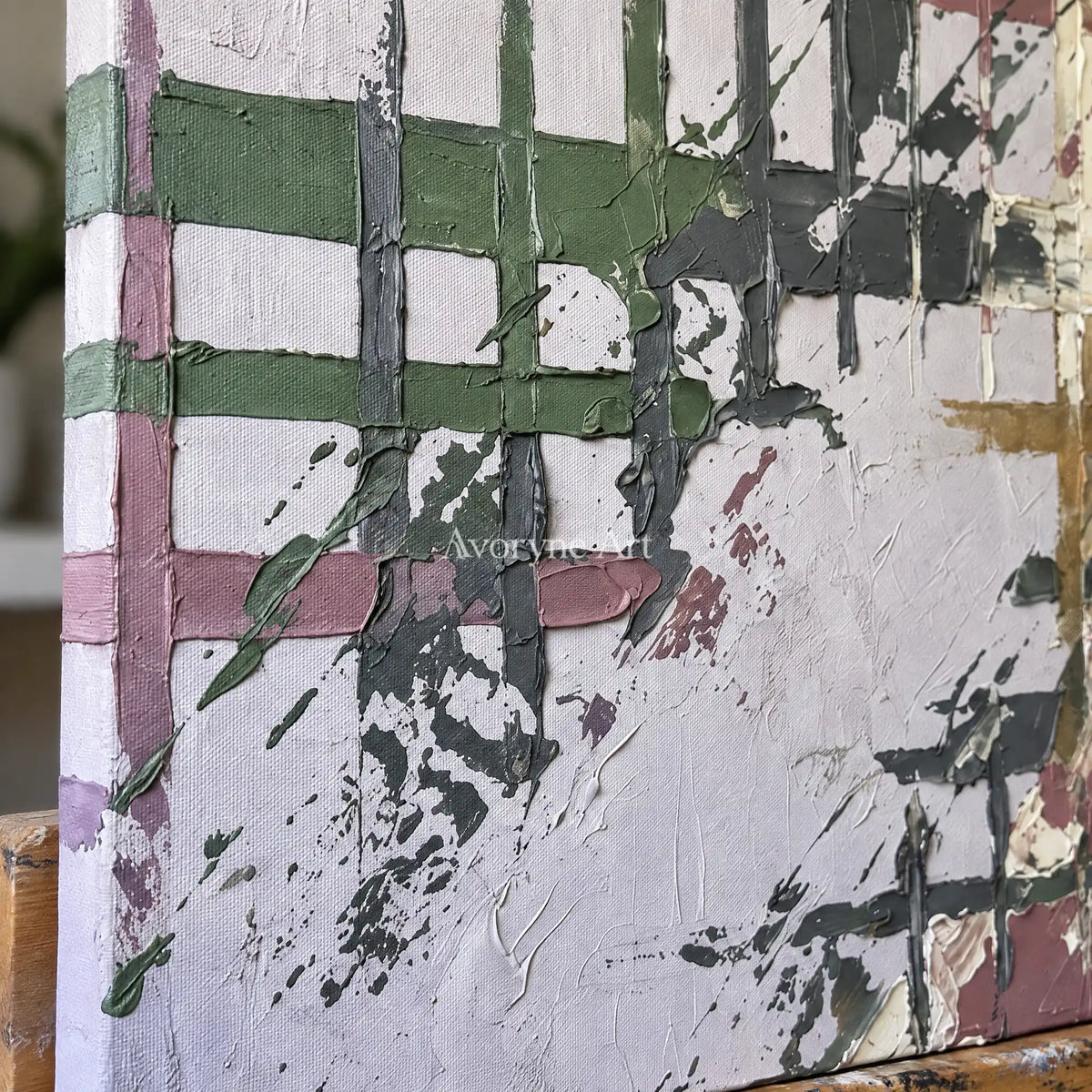 Close-up of the hand-painted texture of Weathered Gesture sage earth grid wall art on an easel