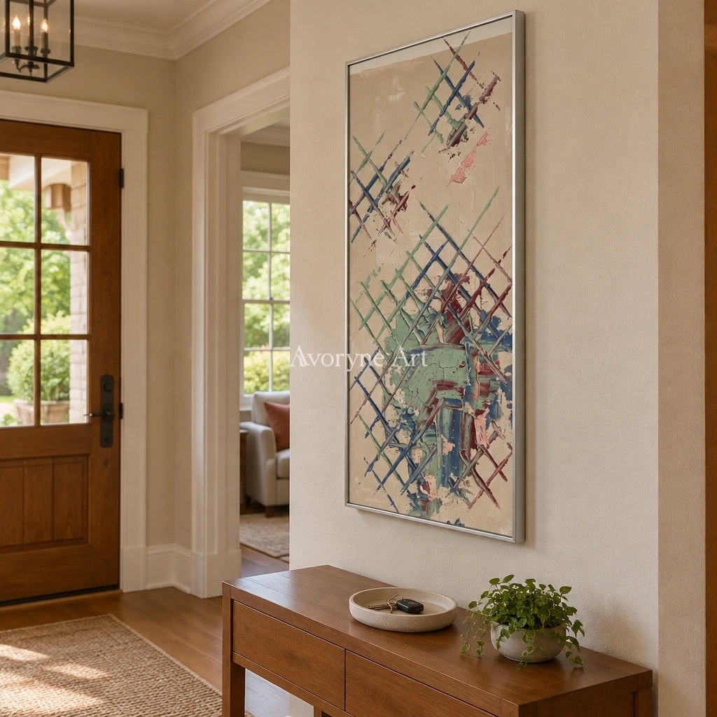 Earthen Current sage earth grid wall art with a silver frame in an entryway
