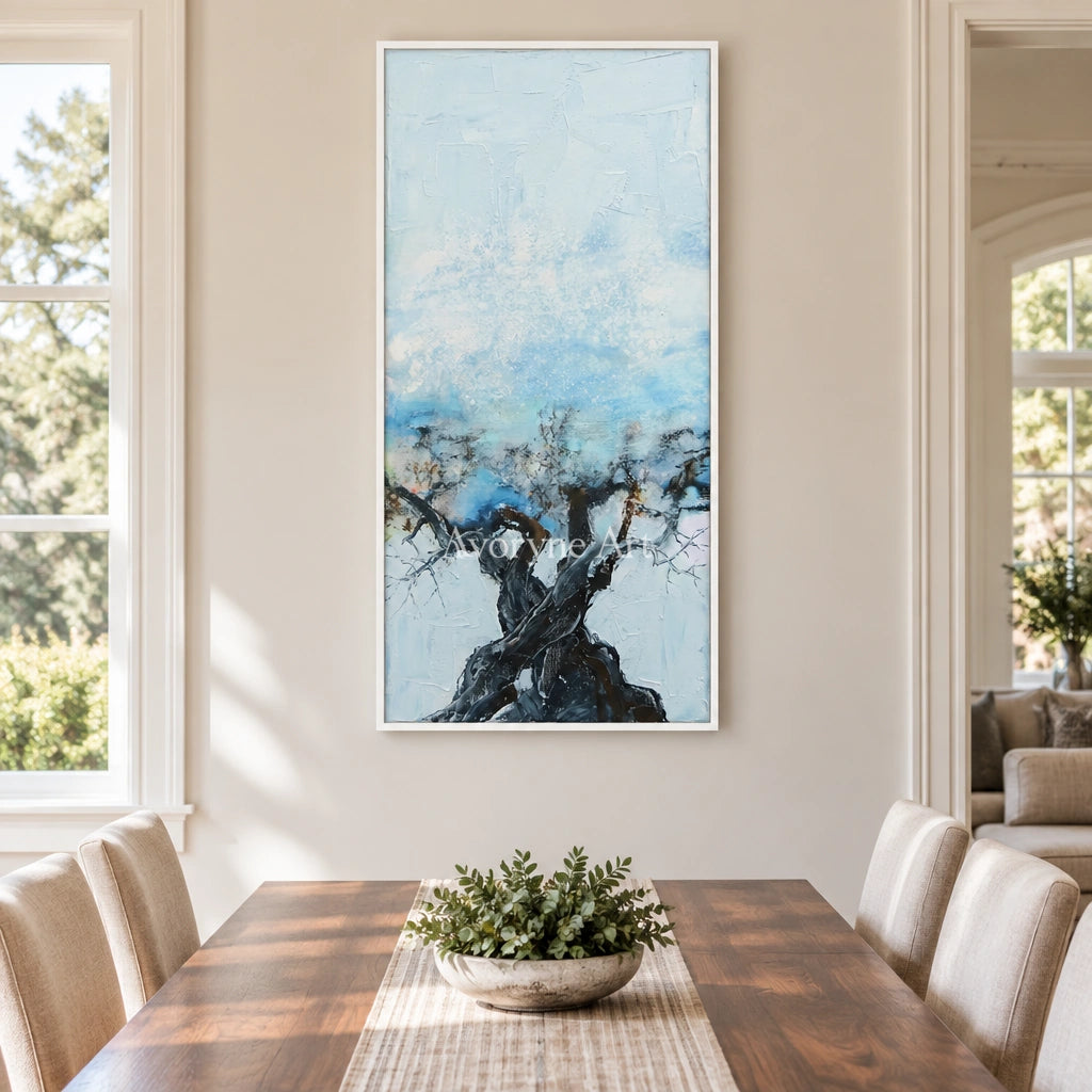 Blue Story snow branch wall art with a white frame in a dining room