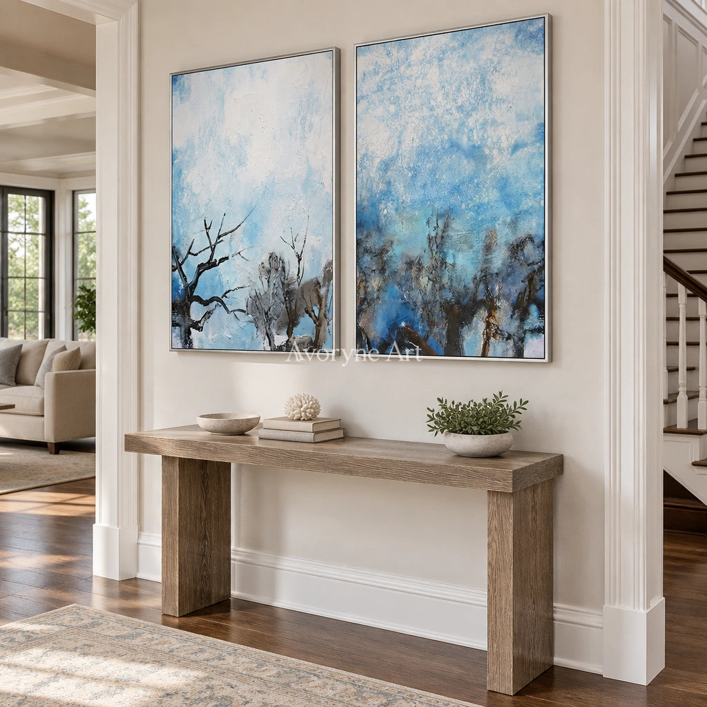 Pale Mosaic snow branch diptych with a silver frame in an entryway