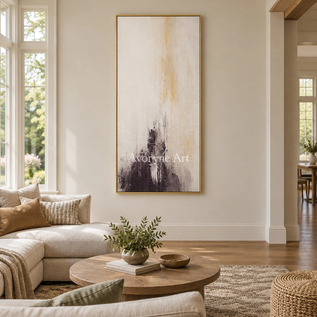Woven Haven soft neutral abstract wall art with a gold frame hanging in a living room