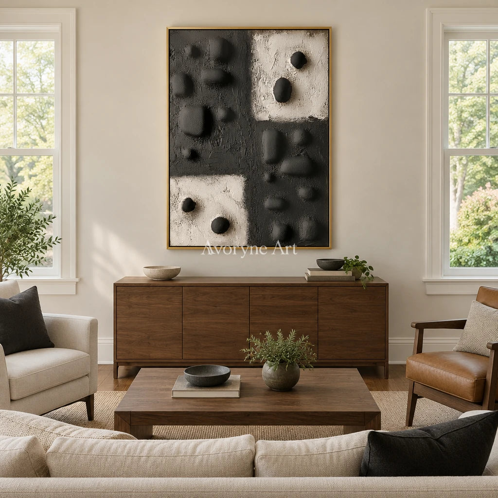 Muted Refrain stone dot relief wall art with a gold frame hanging in a living room
