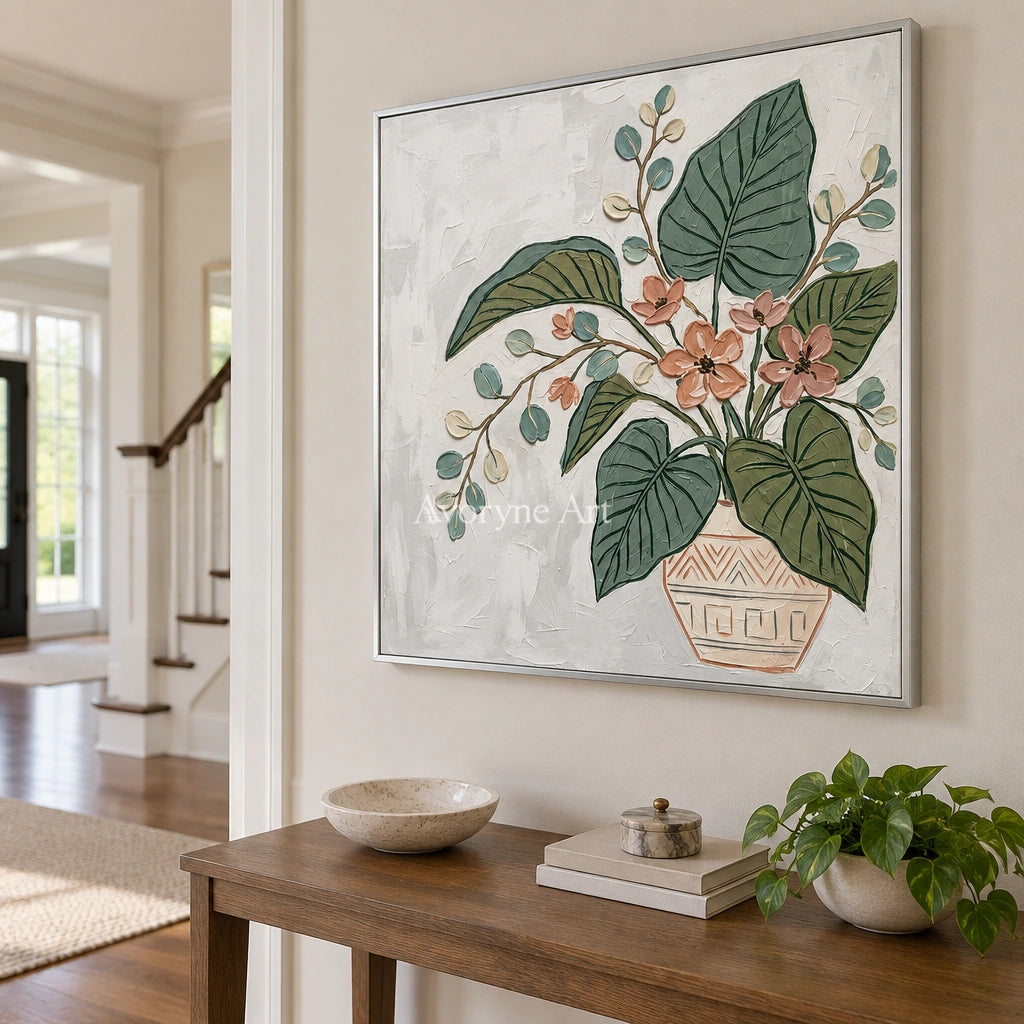 Silver Passage vase and foliage wall art with a silver frame in an entryway