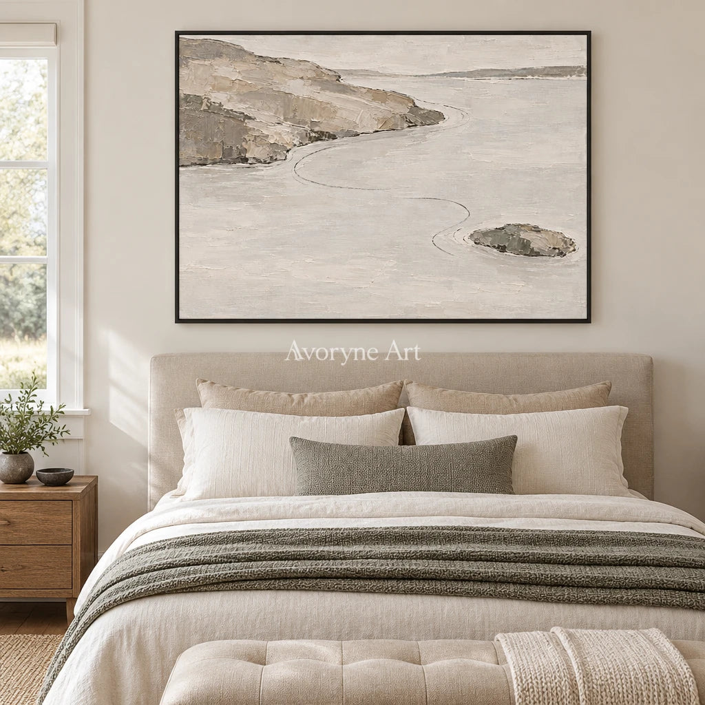 Still Solace waterside landscape wall art with a black frame above a bed in a bedroom