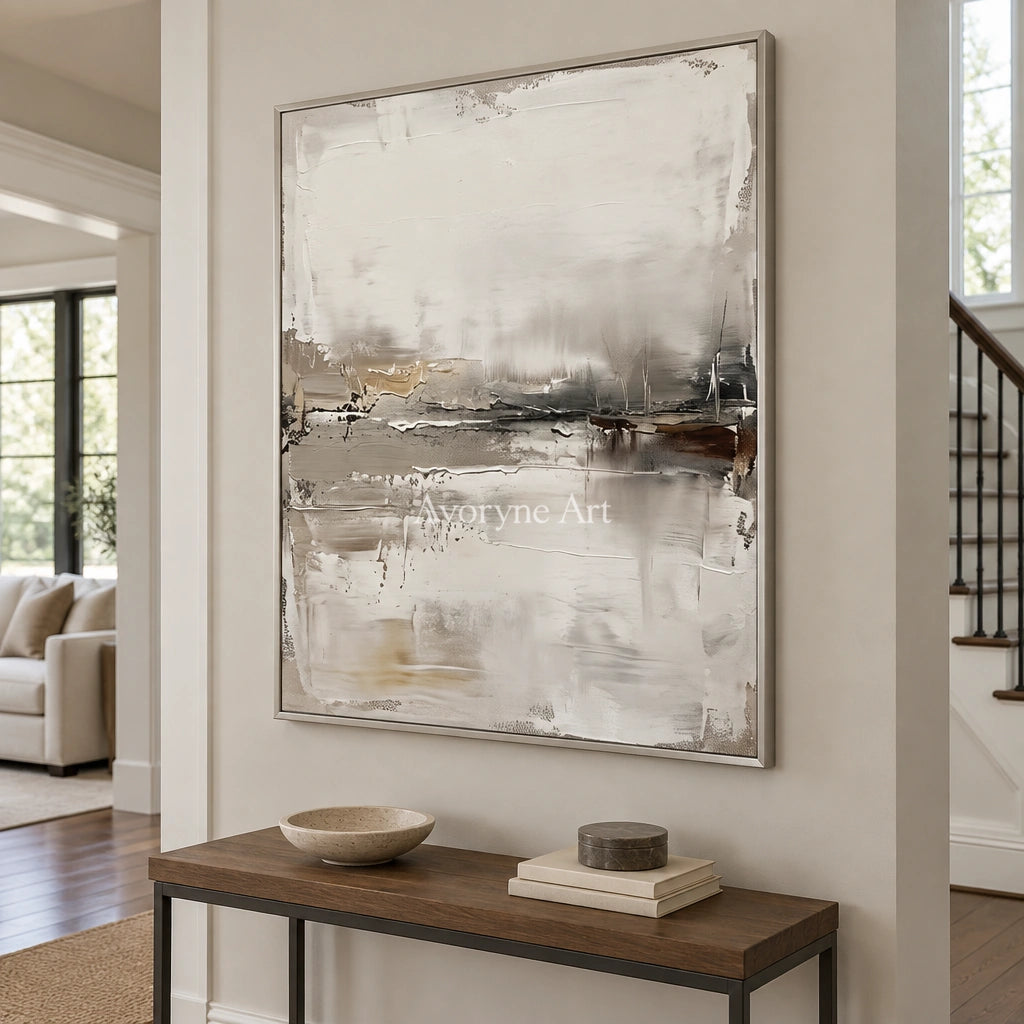 Bright Trace waterside landscape wall art with a silver frame in an entryway