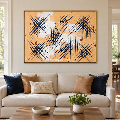 Silver Dialogue abstract brushwork wall art with a gold frame hanging in a living room