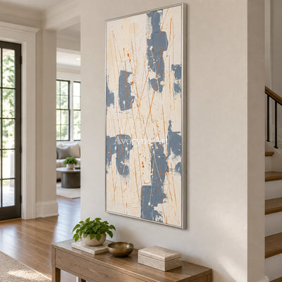 Golden Gesture abstract brushwork wall art with a silver frame in an entryway