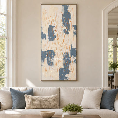 Golden Gesture abstract brushwork wall art with a gold frame hanging in a living room