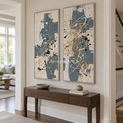 Golden Verse abstract brushwork diptych with a silver frame in an entryway