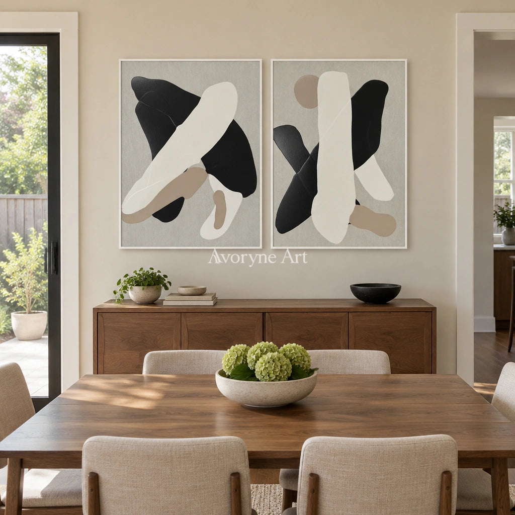 Muted Sonata black neutral organic art diptych with a white frame in a dining room