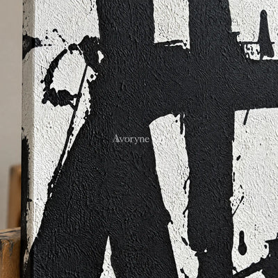 Close-up of the hand-painted texture of Muted Field black white brushwork triptych on an easel