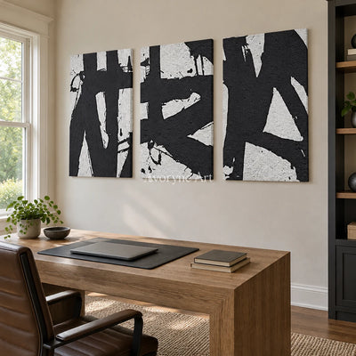 Muted Field black white brushwork triptych as a frameless stretched canvas in a home office