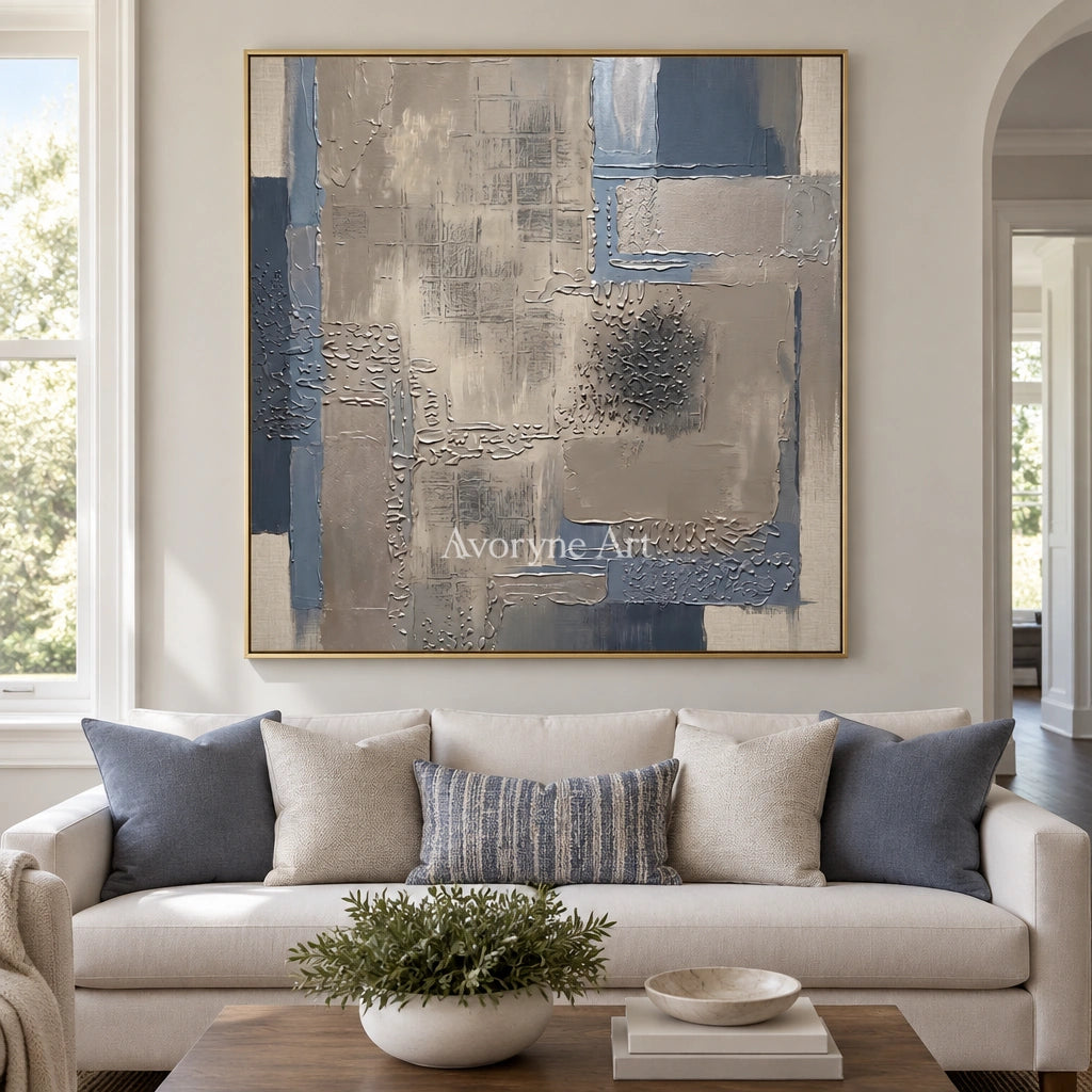 Amber Echo block relief wall art with a gold frame hanging in a living room