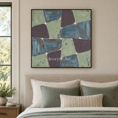 Soft Interval block relief wall art with a black frame above a bed in a bedroom