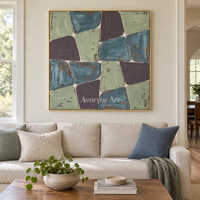 Soft Interval block relief wall art with a gold frame hanging in a living room
