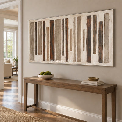 Soft Echo block relief wall art with a silver frame in an entryway