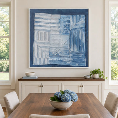 Earthen Solace blue geometric texture wall art with a white frame in a dining room