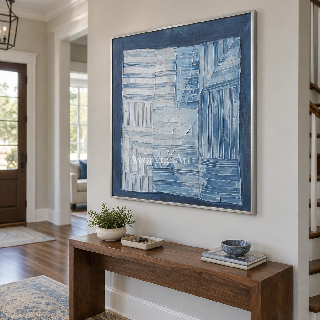 Earthen Solace blue geometric texture wall art with a silver frame in an entryway