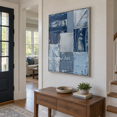 Hushed Measure blue geometric texture wall art with a silver frame in an entryway