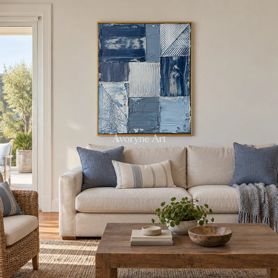 Hushed Measure blue geometric texture wall art with a gold frame hanging in a living room
