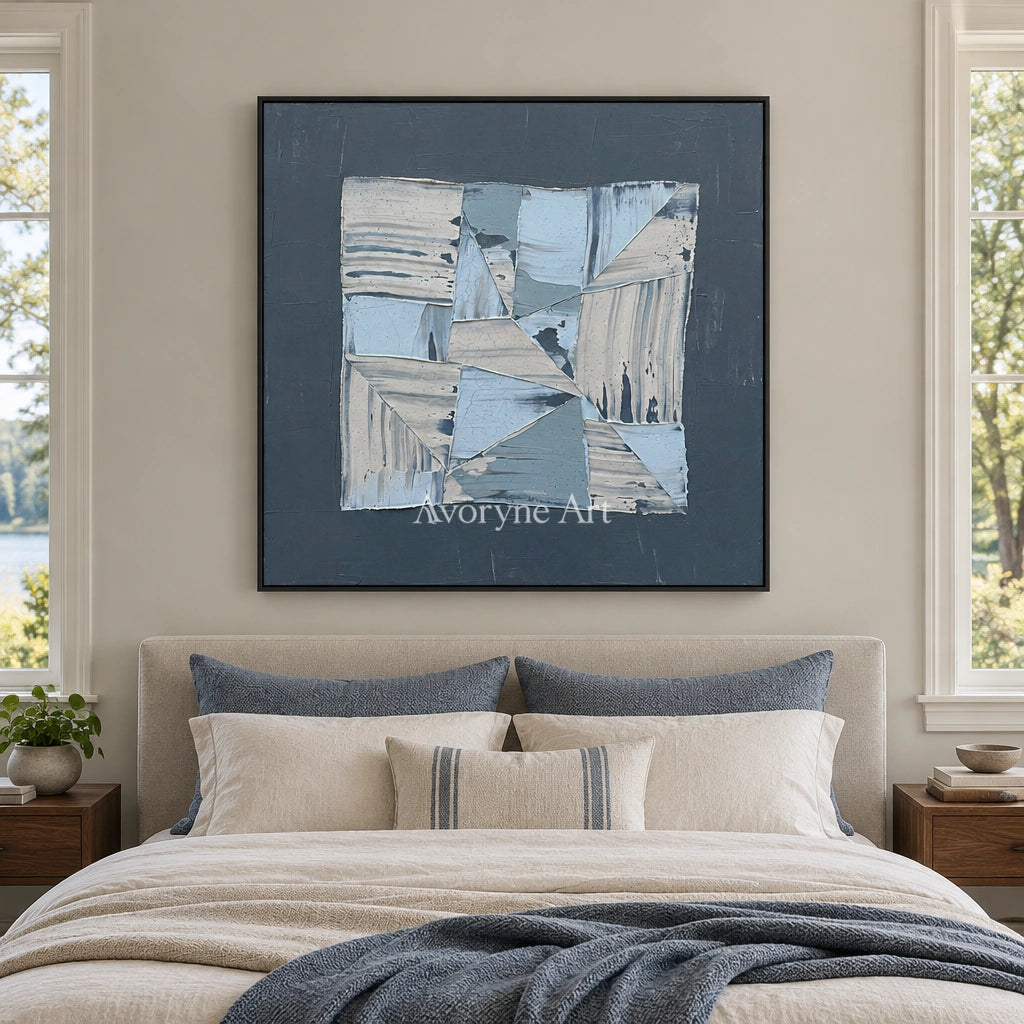 Hushed Rhythm blue geometric texture wall art with a black frame above a bed in a bedroom