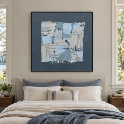 Hushed Rhythm blue geometric texture wall art with a black frame above a bed in a bedroom