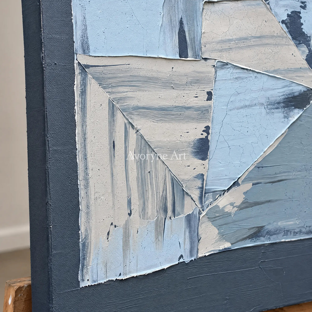 Close-up of the hand-painted texture of Hushed Rhythm blue geometric texture wall art on an easel