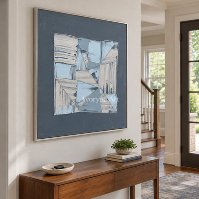 Hushed Rhythm blue geometric texture wall art with a silver frame in an entryway