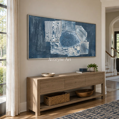 Mineral Passage blue geometric texture wall art with a silver frame in an entryway