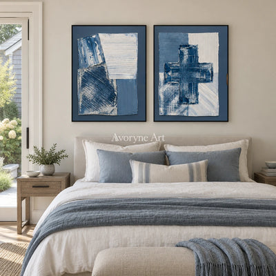 Soft Refrain blue geometric texture diptych with a black frame above a bed in a bedroom