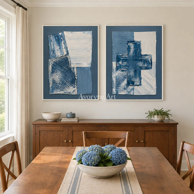 Soft Refrain blue geometric texture diptych with a white frame in a dining room