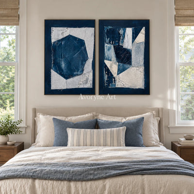 Hushed Current blue geometric texture diptych with a black frame above a bed in a bedroom