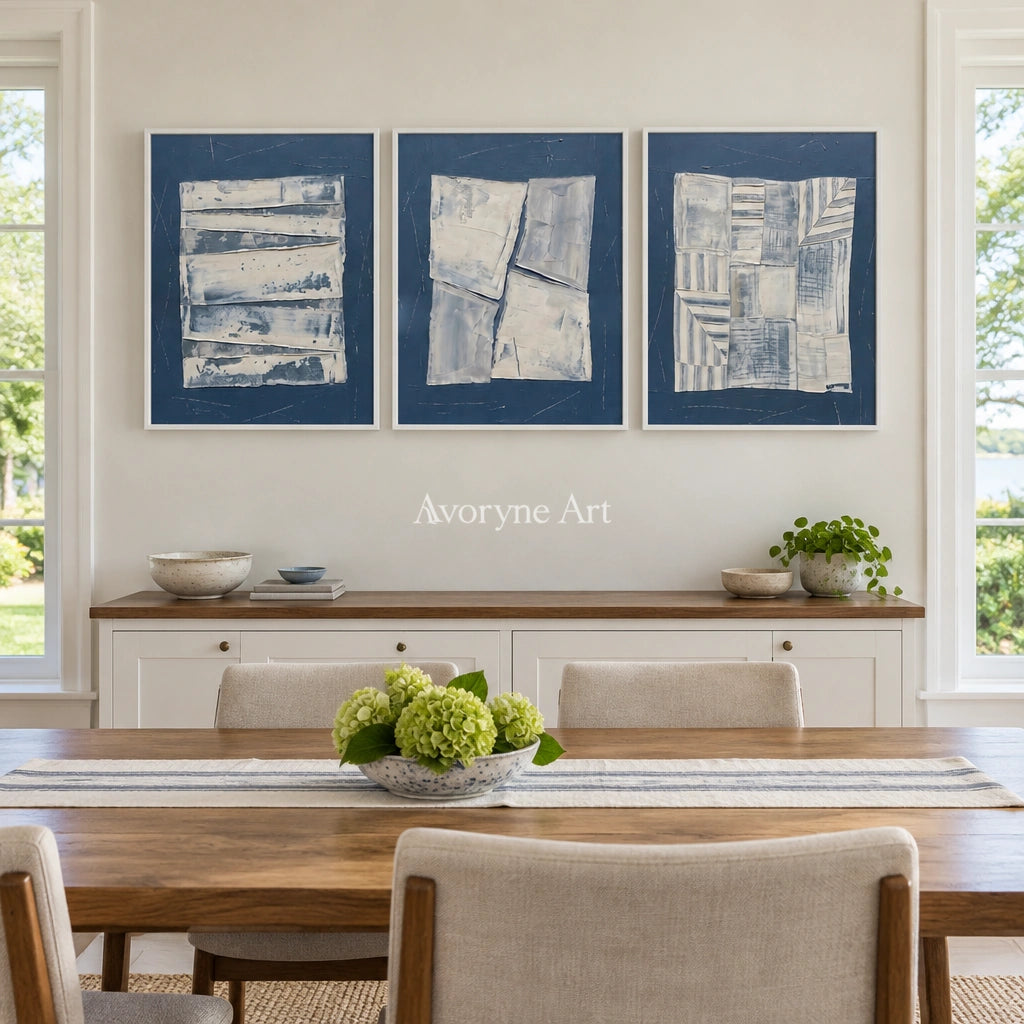 Hushed Solace blue geometric texture triptych with a white frame in a dining room