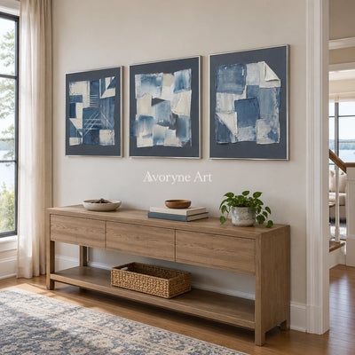 Mineral Horizon blue geometric texture triptych with a silver frame in an entryway