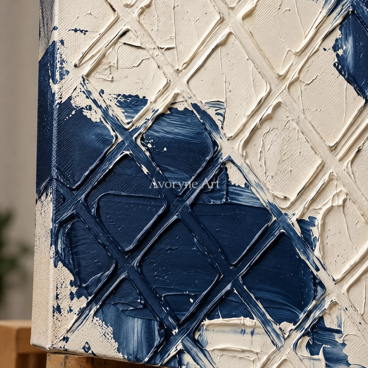 Close-up of the hand-painted texture of Weathered Current blue ivory grid wall art on an easel
