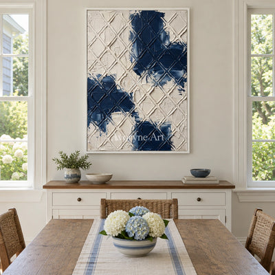 Weathered Current blue ivory grid wall art with a white frame in a dining room