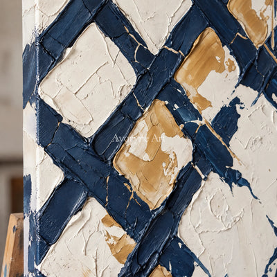 Close-up of the hand-painted texture of Earthen Refrain blue ivory grid wall art on an easel