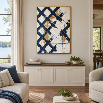 Earthen Refrain blue ivory grid wall art with a gold frame hanging in a living room