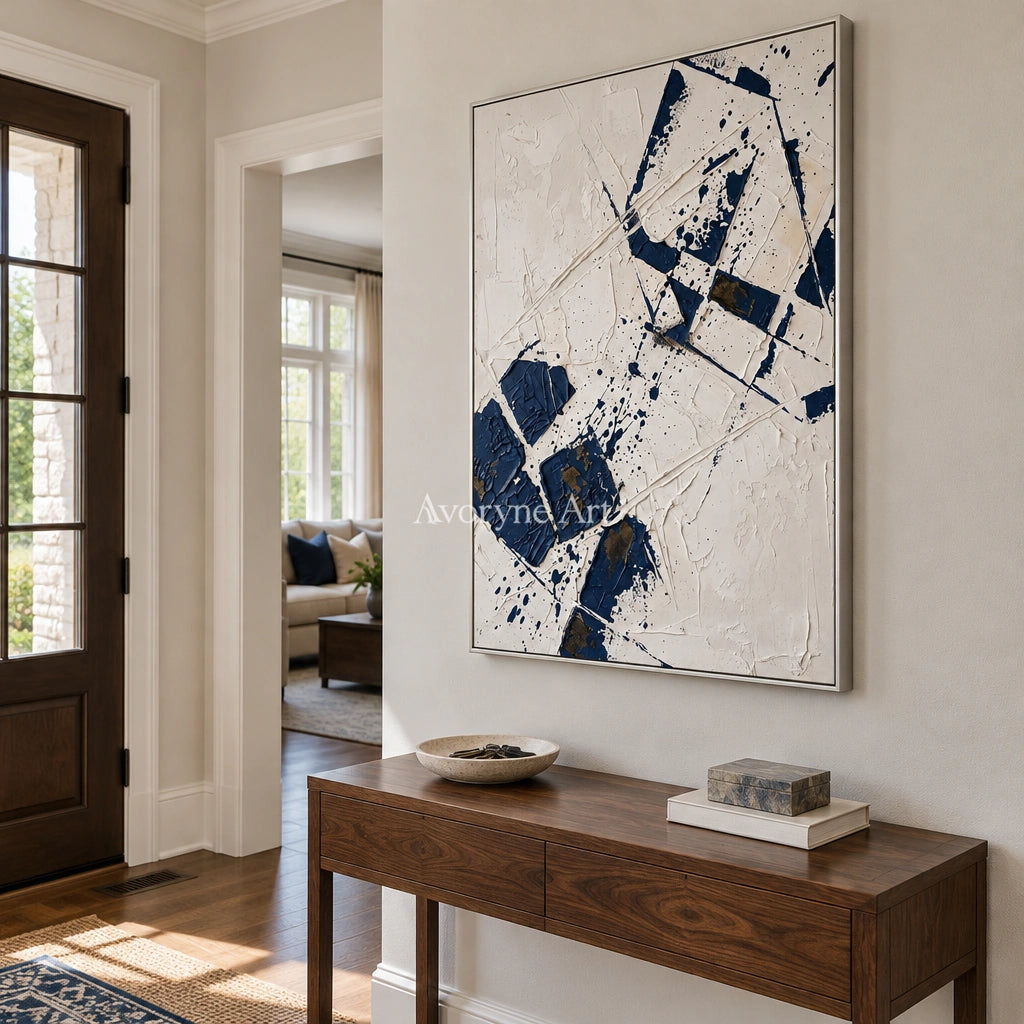 Earthen Reverie blue ivory grid wall art with a silver frame in an entryway