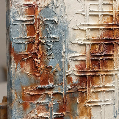 Close-up of the hand-painted texture of Woven Verse blue rust texture wall art on an easel