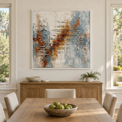 Woven Verse blue rust texture wall art with a white frame in a dining room