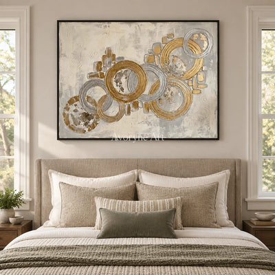 Soft Gesture circle relief wall art with a black frame above a bed in a bedroom