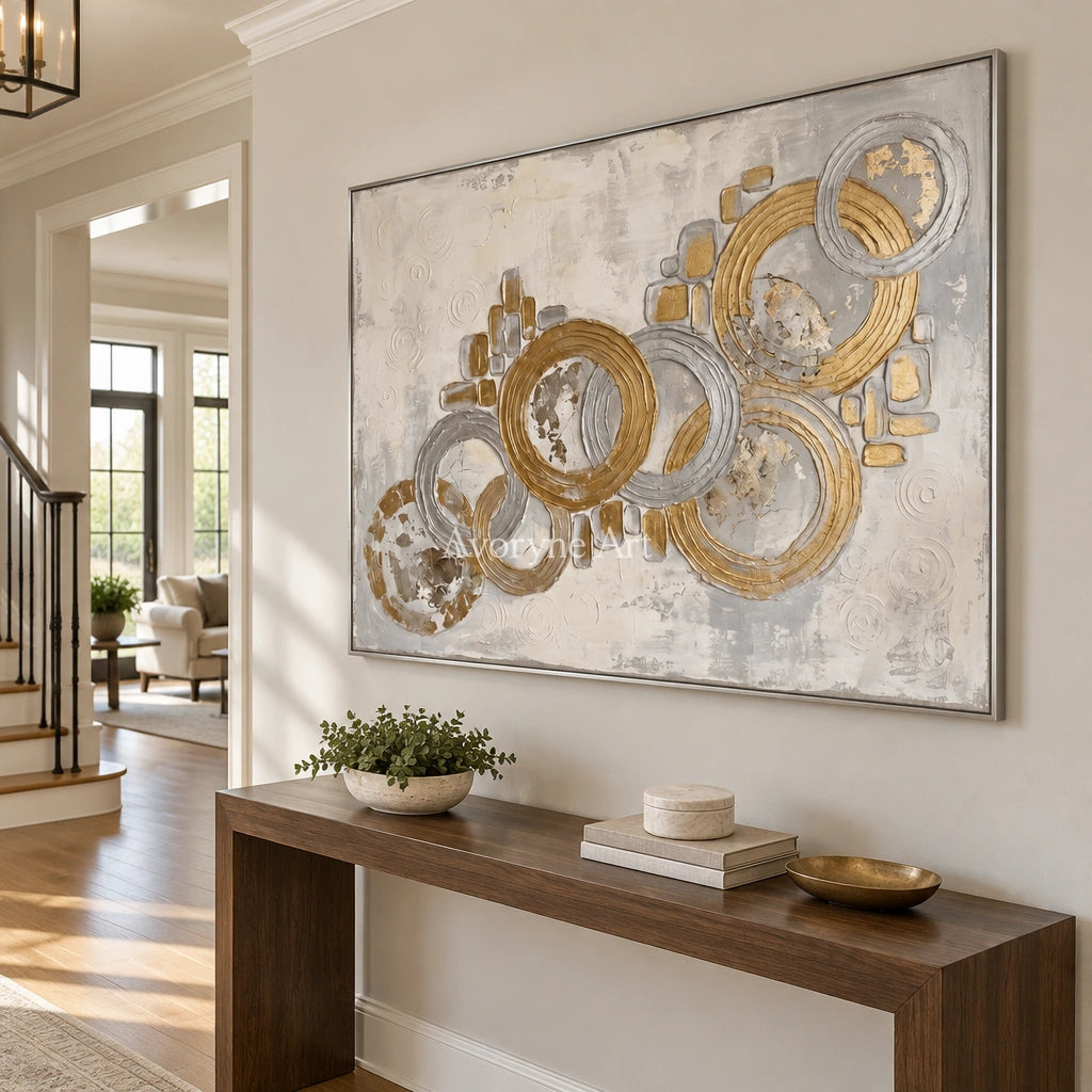 Soft Gesture circle relief wall art with a silver frame in an entryway