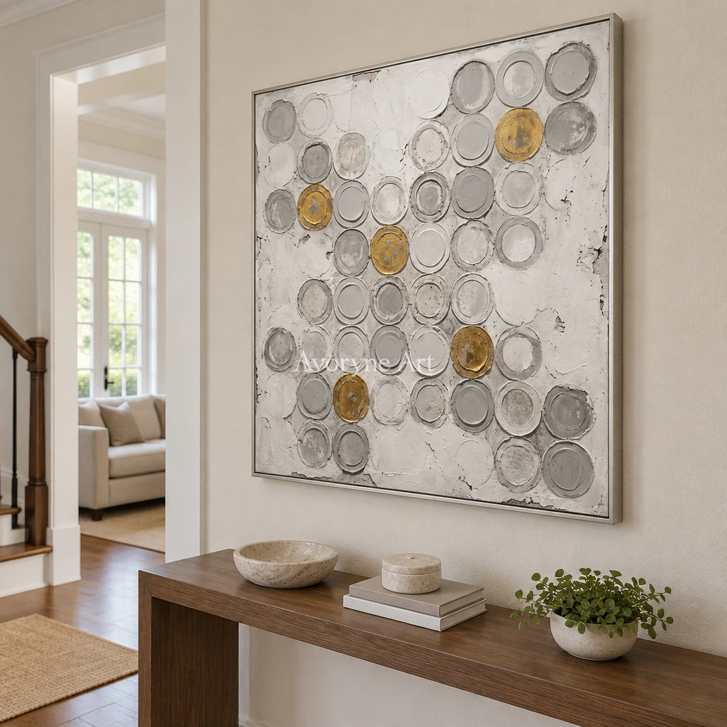 Soft Mosaic circle relief wall art with a silver frame in an entryway